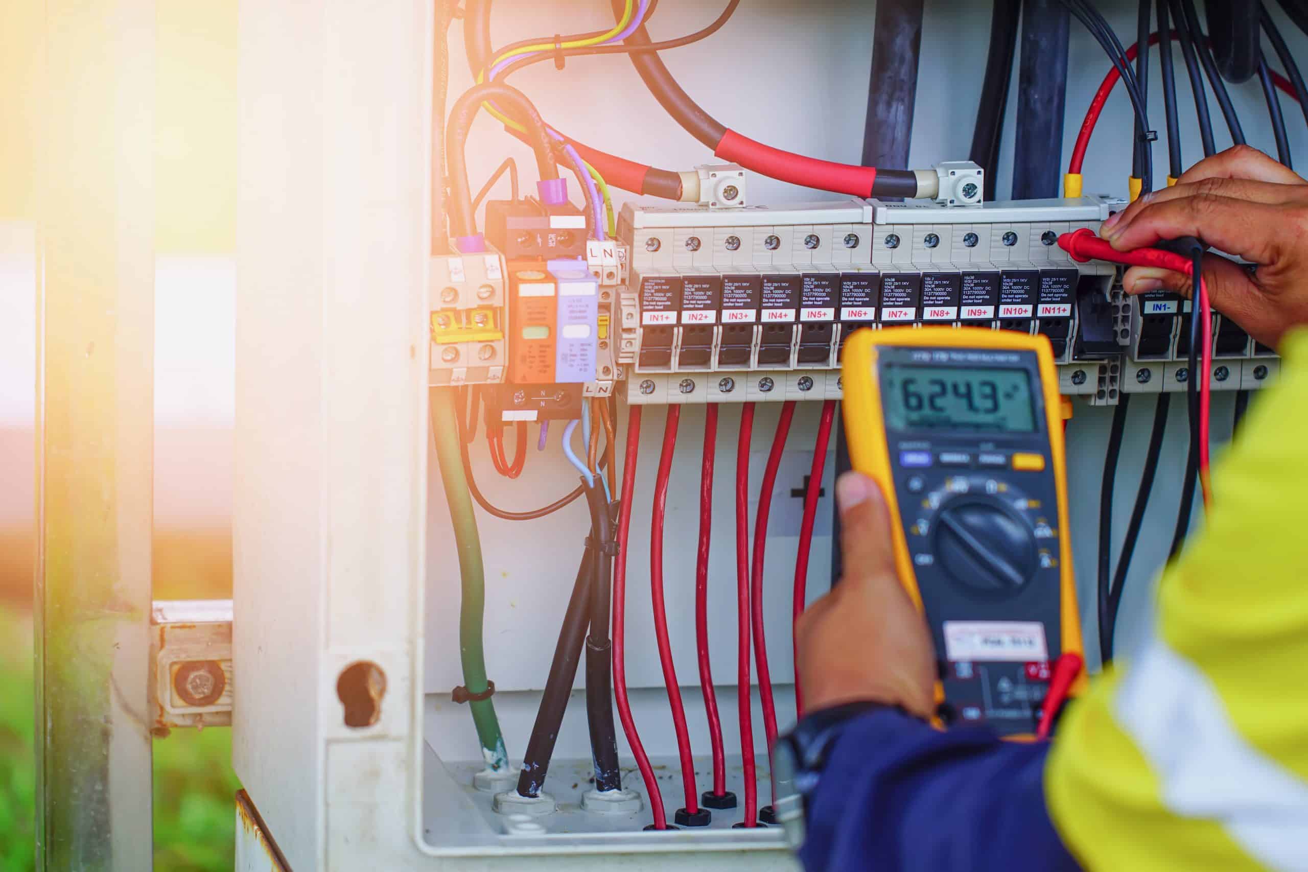 Licensed electrician inspecting a residential electric panel for safe power distribution and reliable electrical service in Fort Worth, TX