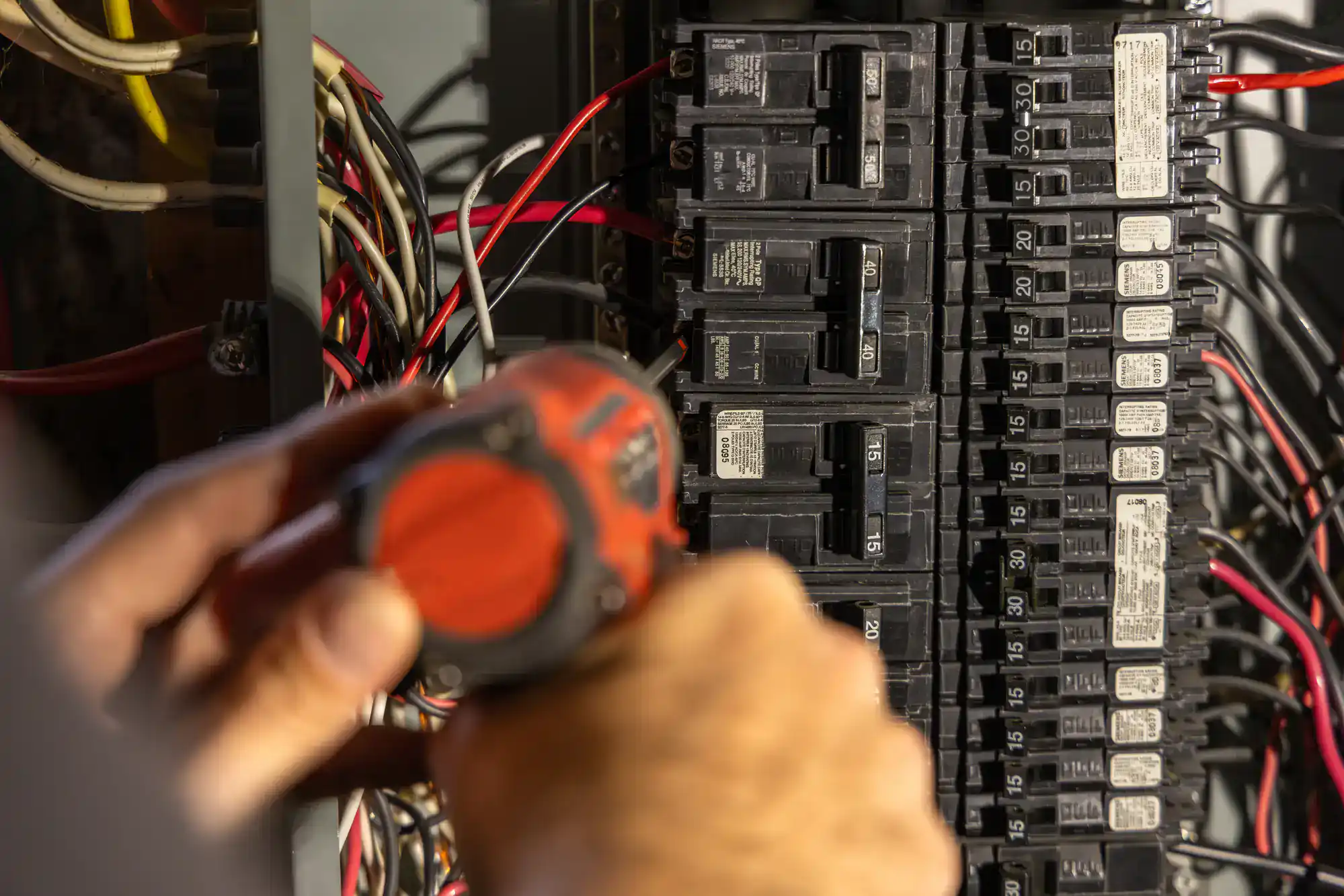 Professional electrical panel maintenance and repair work on a home circuit system in Dallas County, Texas