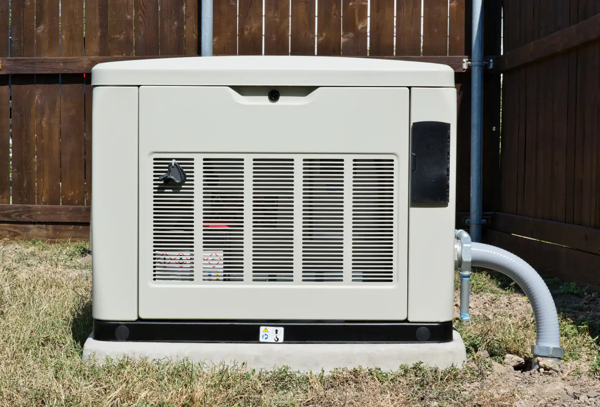 Professional outdoor generator installation in a residential backyard in Dallas County, Texas, with technicians connecting the unit safely.